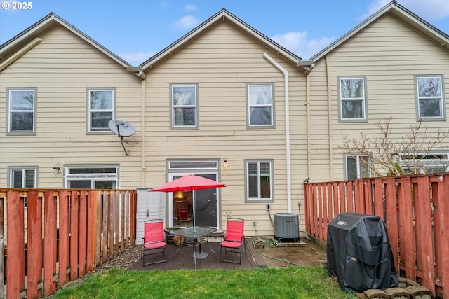 back of property featuring a patio area, a fenced backyard, and cooling unit