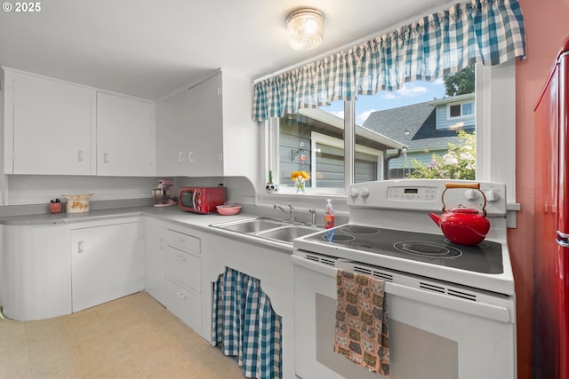 4315 SE Rhodesa St, Milwaukie, OR 97222 - kitchen featuring electric range, white cabinetry, and light countertops