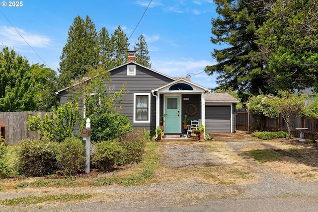 4315 SE Rhodesa St, Milwaukie, OR 97222 - view of front of property featuring driveway, a garage, and a chimney