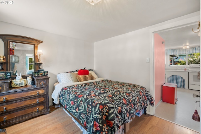 4315 SE Rhodesa St, Milwaukie, OR 97222 - bedroom featuring wood finished floors and multiple windows