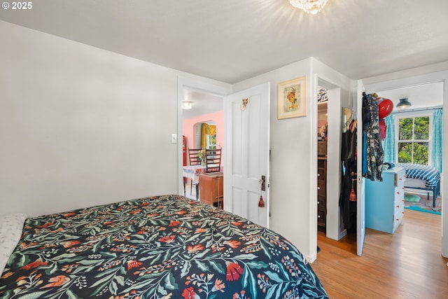 4315 SE Rhodesa St, Milwaukie, OR 97222 - bedroom featuring light wood-type flooring and arched walkways