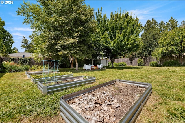 4315 SE Rhodesa St, Milwaukie, OR 97222 - view of community with a vegetable garden, a storage unit, and a fenced backyard