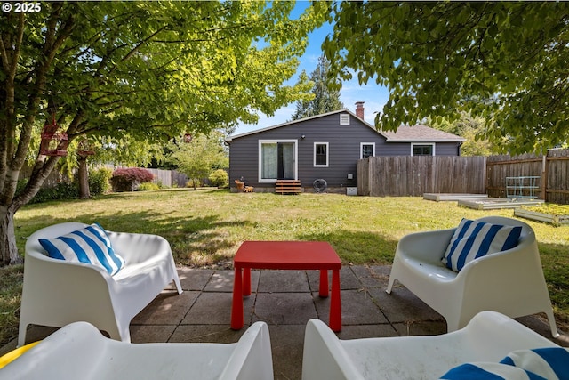 4315 SE Rhodesa St, Milwaukie, OR 97222 - fenced backyard with entry steps, an outdoor hangout area, a garden, and a patio area