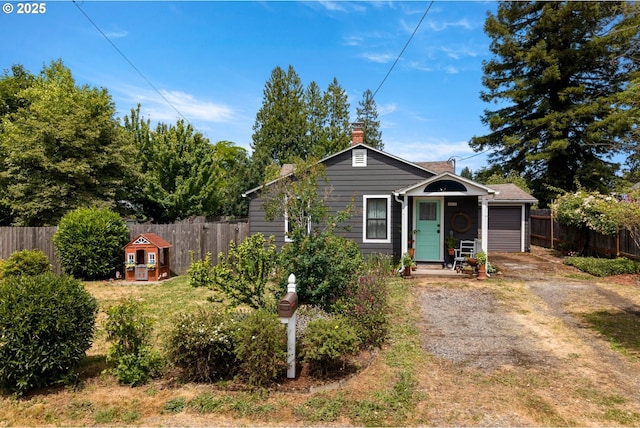 4315 SE Rhodesa St, Milwaukie, OR 97222 - bungalow-style home with driveway and a chimney