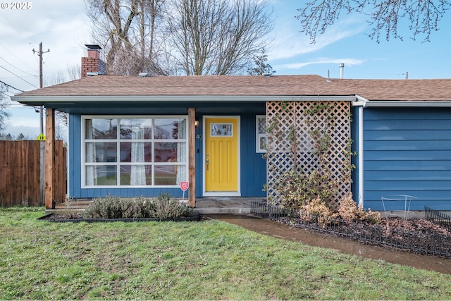 single story home featuring roof with shingles, a front lawn, a chimney, and fence