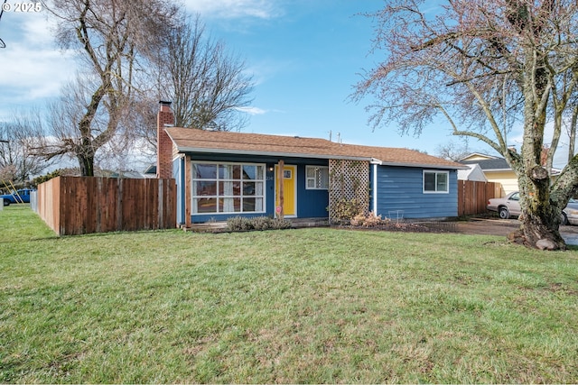 ranch-style home with a chimney, fence, and a front lawn