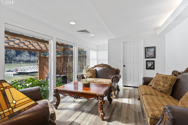 9202 Phey Ln, Florence, OR 97439 - living area with visible vents, recessed lighting, wood finished floors, a water view, and vaulted ceiling