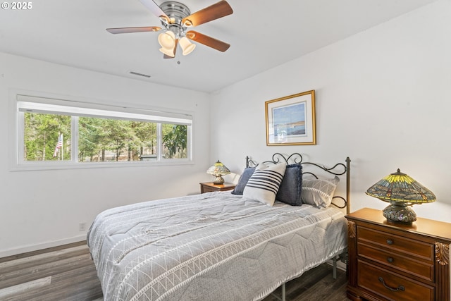 9202 Phey Ln, Florence, OR 97439 - bedroom featuring a ceiling fan, baseboards, visible vents, and wood finished floors