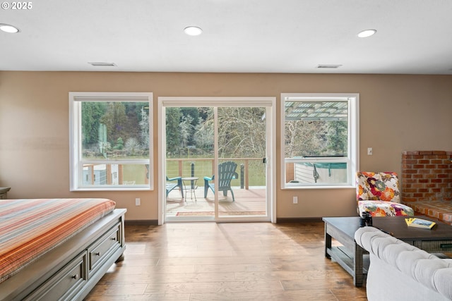 9202 Phey Ln, Florence, OR 97439 - bedroom with visible vents, multiple windows, recessed lighting, and access to exterior