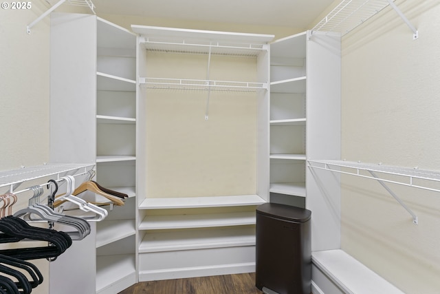 9202 Phey Ln, Florence, OR 97439 - walk in closet with dark wood-style flooring