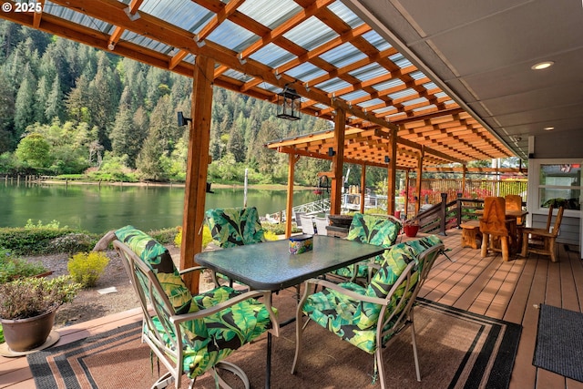9202 Phey Ln, Florence, OR 97439 - deck featuring outdoor dining area, a water view, and a forest view