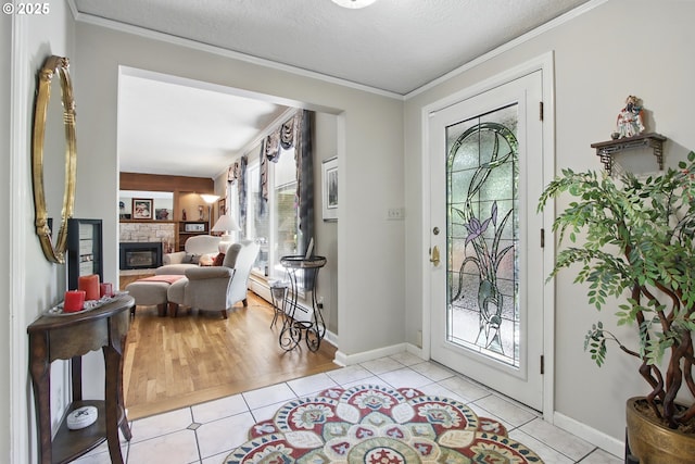 13720 SW Butner Rd, Beaverton, OR 97005 - entrance foyer with tile patterned flooring, a fireplace, crown molding, a baseboard radiator, and baseboards