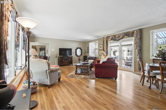 13720 SW Butner Rd, Beaverton, OR 97005 - living room with light wood-style flooring, crown molding, and a textured ceiling
