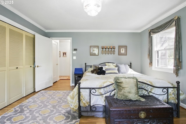 13720 SW Butner Rd, Beaverton, OR 97005 - bedroom featuring ornamental molding, wood finished floors, a closet, and baseboards