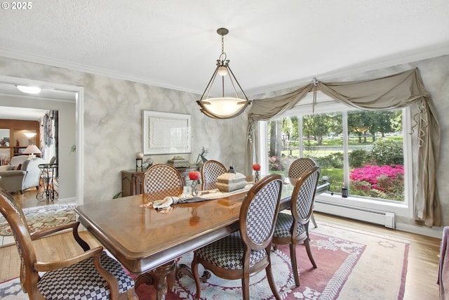 13720 SW Butner Rd, Beaverton, OR 97005 - dining area with a baseboard radiator, light wood finished floors, healthy amount of natural light, and crown molding