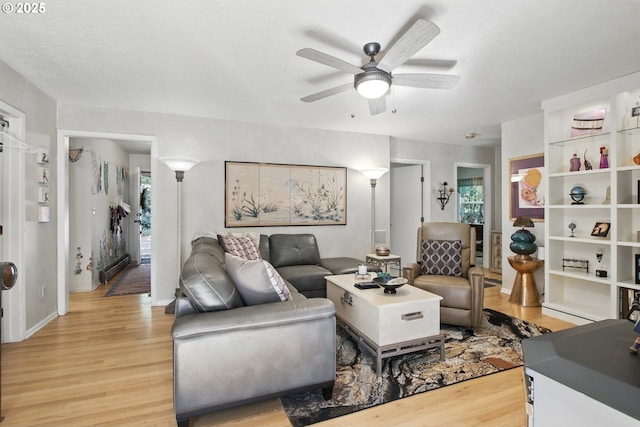 13720 SW Butner Rd, Beaverton, OR 97005 - living room with light wood finished floors, ceiling fan, and baseboards