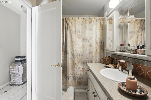 13720 SW Butner Rd, Beaverton, OR 97005 - bathroom with tile patterned floors, vanity, baseboards, and a shower with shower curtain