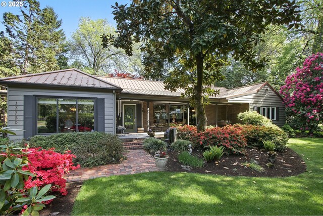 13720 SW Butner Rd, Beaverton, OR 97005 - rear view of property with covered porch, a standing seam roof, a yard, and metal roof