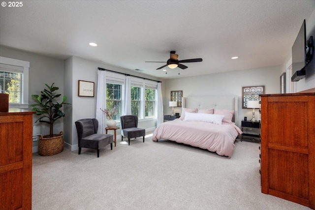 bedroom with recessed lighting, carpet flooring, and multiple windows
