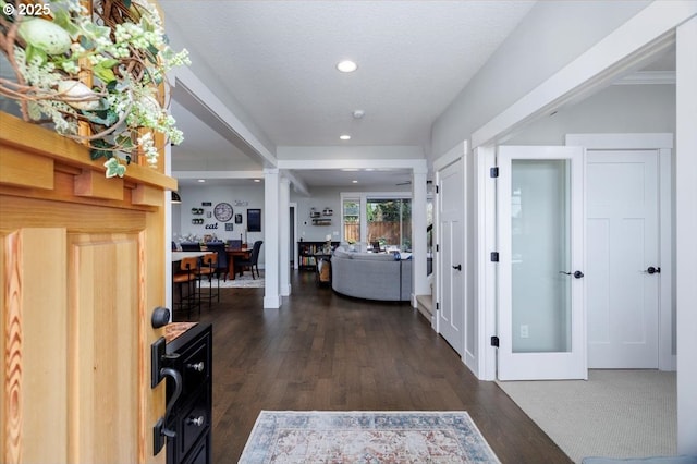 corridor with recessed lighting and dark wood-style floors