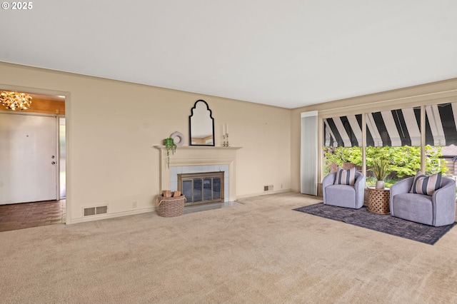 1228 11th St, Astoria, OR 97103 - living room with carpet flooring, a tile fireplace, and a chandelier