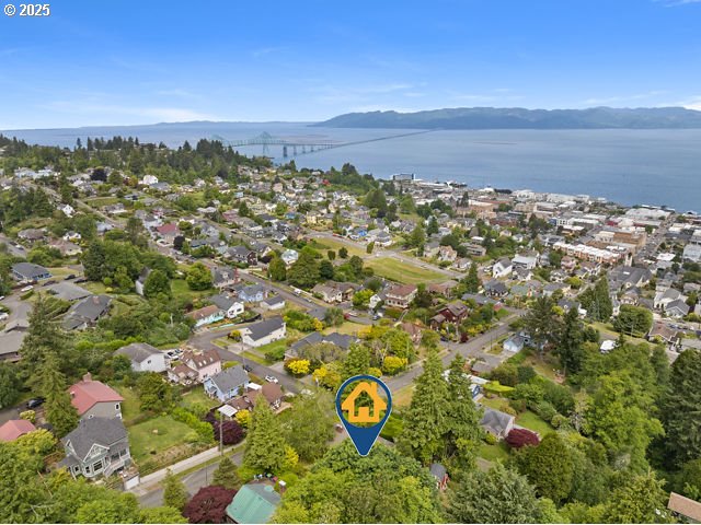 1228 11th St, Astoria, OR 97103 - aerial overview of property's location with a water and mountain view and nearby suburban area