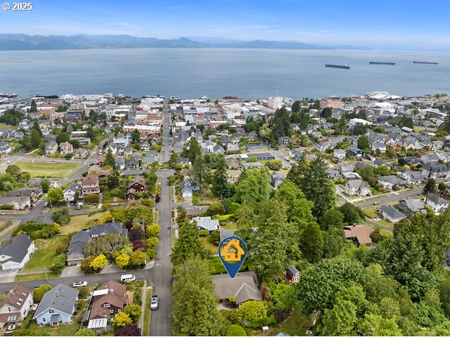 1228 11th St, Astoria, OR 97103 - aerial view of property and surrounding area with nearby suburban area and a large body of water