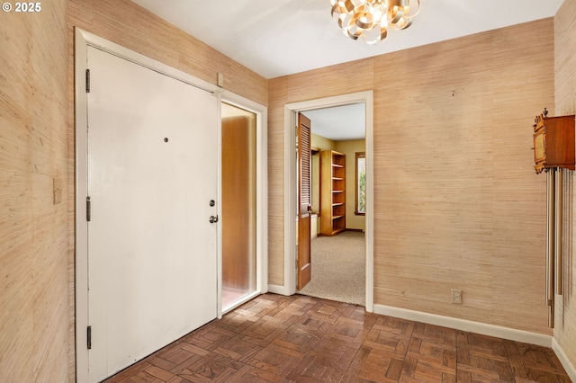 1228 11th St, Astoria, OR 97103 - hall featuring a chandelier and baseboards
