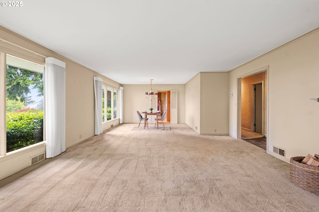 1228 11th St, Astoria, OR 97103 - spare room featuring a chandelier and light carpet