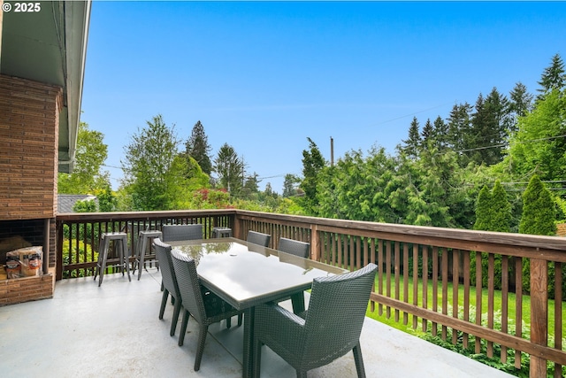 wooden deck with outdoor dining area