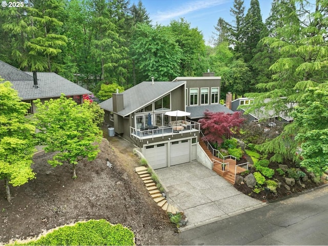11 Da Vinci St, Lake Oswego, OR 97035 - mid-century inspired home featuring a chimney, driveway, a garage, and a deck