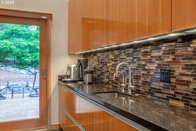 11 Da Vinci St, Lake Oswego, OR 97035 - kitchen with a sink, backsplash, dark stone counters, and modern cabinets