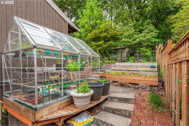 11 Da Vinci St, Lake Oswego, OR 97035 - fenced yard with a greenhouse, a vegetable garden, and an outdoor structure