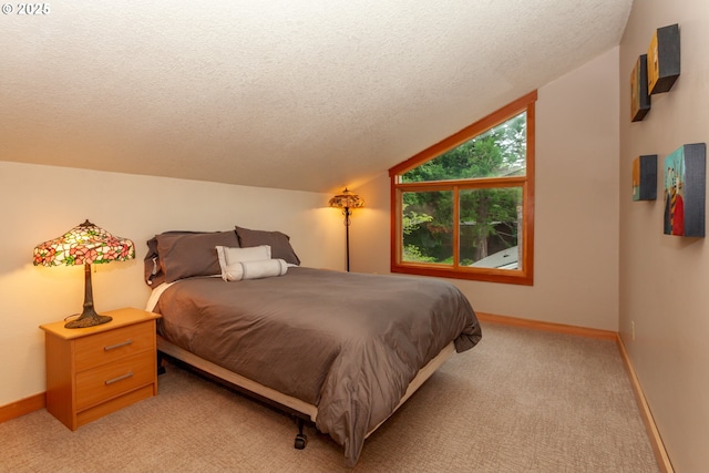 11 Da Vinci St, Lake Oswego, OR 97035 - bedroom with a textured ceiling, baseboards, light carpet, and lofted ceiling