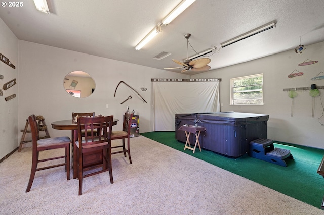 290 12th Ave, Hammond, OR 97121 - carpeted dining room with a ceiling fan and a textured ceiling
