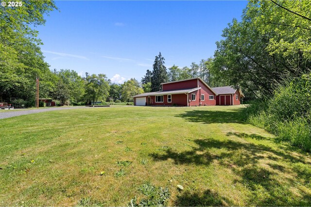 290 12th Ave, Hammond, OR 97121 - view of grassy yard with a garage