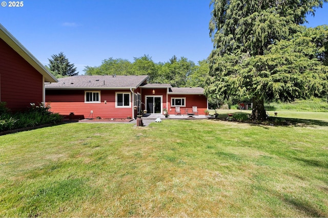 290 12th Ave, Hammond, OR 97121 - rear view of house with a patio and a lawn