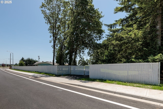 34546 Moore Rd, Scappoose, OR 97056 - view of asphalt road featuring sidewalks and street lights
