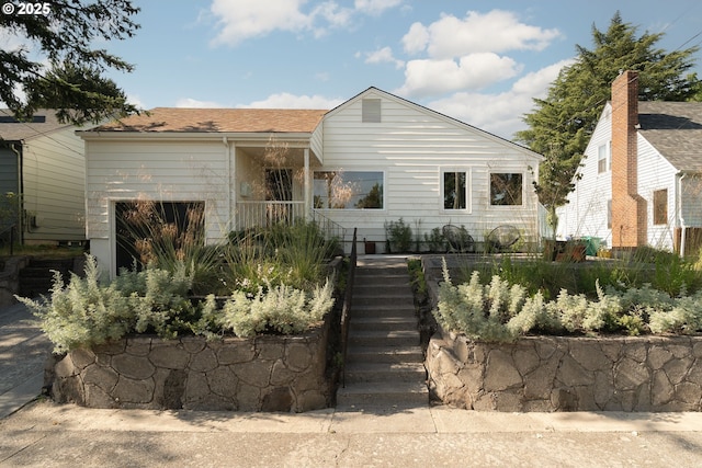 3511 NE Rosa Parks Way, Portland, OR 97211 - view of front facade with stairway and a shingled roof