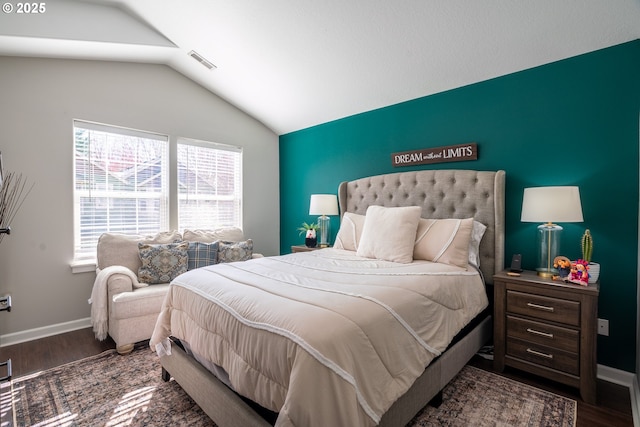 bedroom featuring vaulted ceiling, wood finished floors, and baseboards