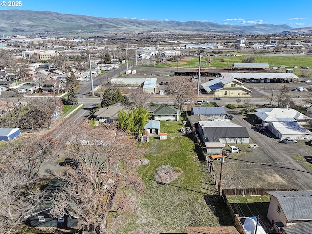 drone / aerial view with a residential view and a mountain view