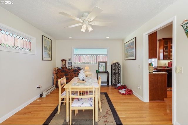 dining area with light wood finished floors, baseboards, a ceiling fan, and recessed lighting