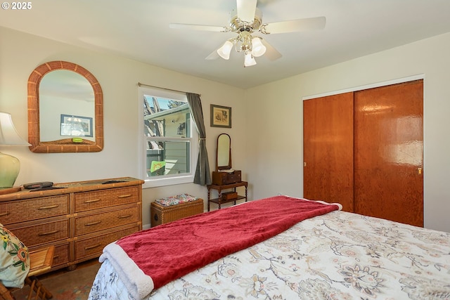 bedroom featuring ceiling fan and a closet