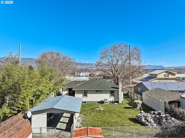 birds eye view of property with a mountain view