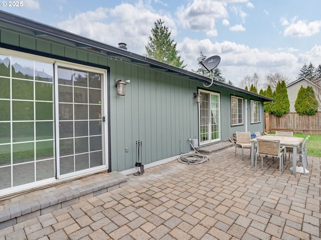 view of patio / terrace with outdoor dining area and fence