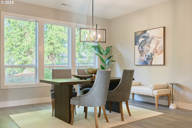 1718 SE 40th St, Brush Prairie, WA 98606 - dining area with wood finished floors, plenty of natural light, and a chandelier