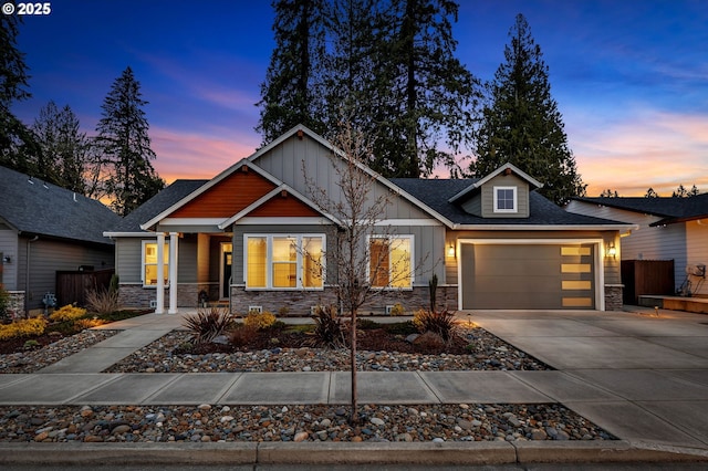 1718 SE 40th St, Brush Prairie, WA 98606 - craftsman house featuring stone siding, board and batten siding, driveway, and an attached garage