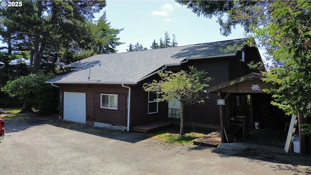 2011/2013 Ohio Ave, North Bend, OR 97459 - view of front facade with a shingled roof, asphalt driveway, and an attached garage