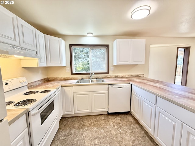 2011/2013 Ohio Ave, North Bend, OR 97459 - kitchen featuring white appliances, under cabinet range hood, light countertops, and white cabinetry