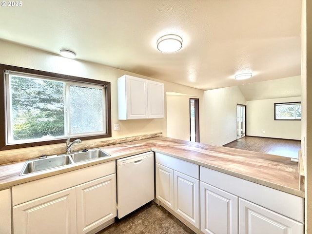 2011/2013 Ohio Ave, North Bend, OR 97459 - kitchen featuring dishwasher, lofted ceiling, white cabinets, a peninsula, and butcher block countertops